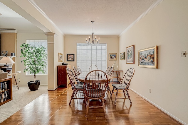 dining room featuring a textured ceiling, wood finished floors, and an inviting chandelier