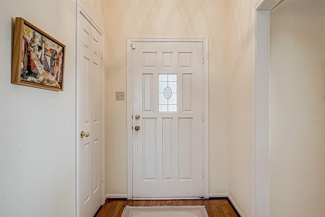 interior space with dark wood-style floors and baseboards