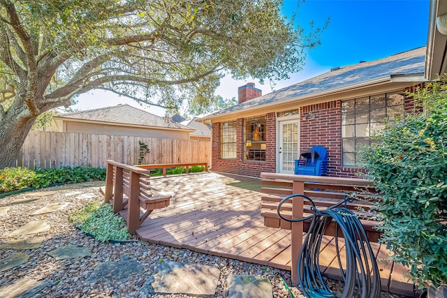 wooden deck featuring fence