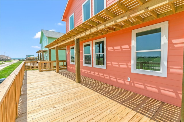 wooden deck featuring a pergola