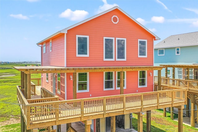 rear view of property featuring a wooden deck