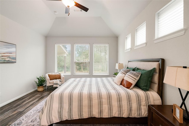 bedroom featuring hardwood / wood-style flooring, vaulted ceiling, and ceiling fan