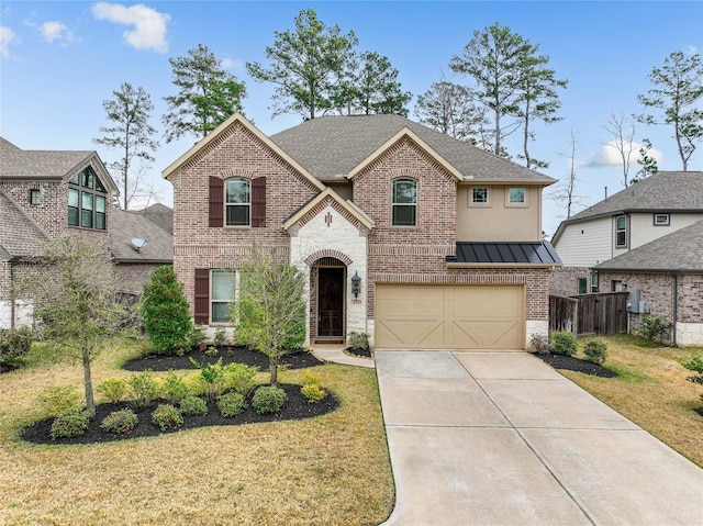 view of front of property with a garage and a front yard