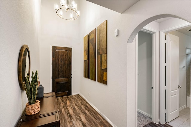 hallway with hardwood / wood-style flooring