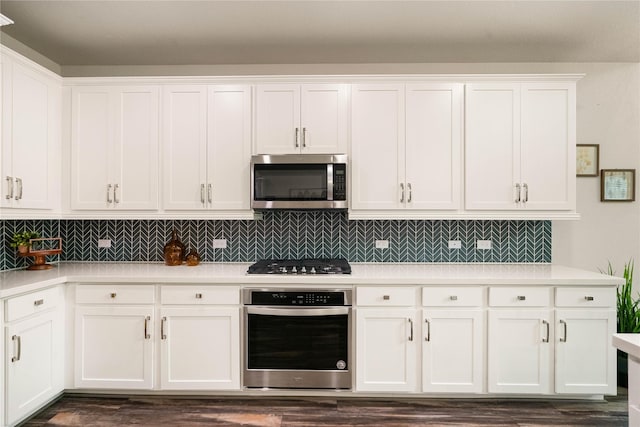 kitchen featuring white cabinetry and appliances with stainless steel finishes