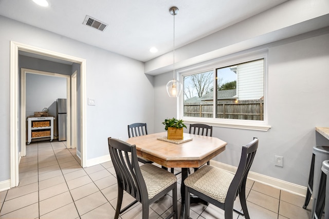 dining space with recessed lighting, visible vents, baseboards, and light tile patterned floors