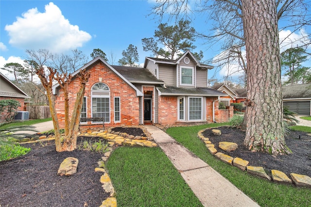 view of front of house featuring roof with shingles, brick siding, central AC unit, a front yard, and fence