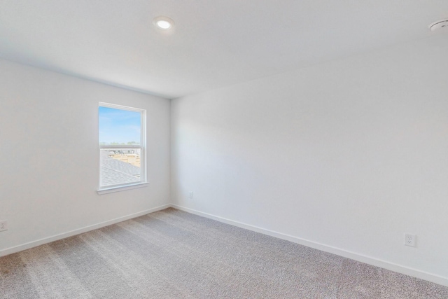 spare room featuring carpet floors