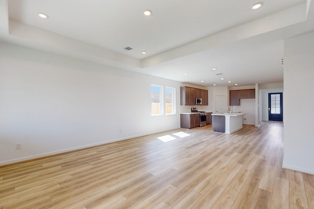 unfurnished living room with light wood-type flooring