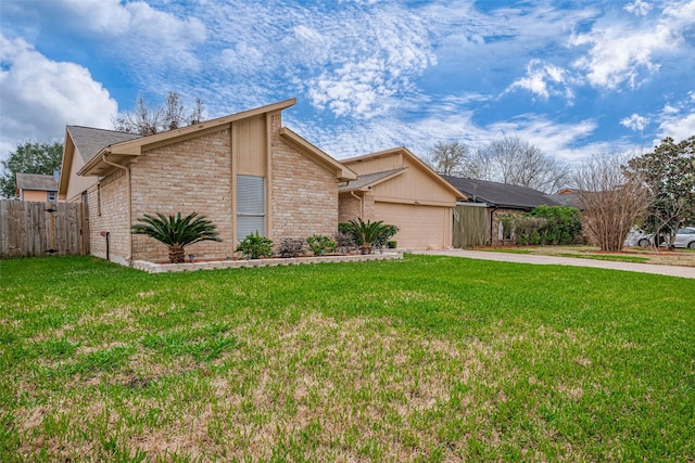 view of front of property featuring brick siding, an attached garage, a front yard, fence, and driveway