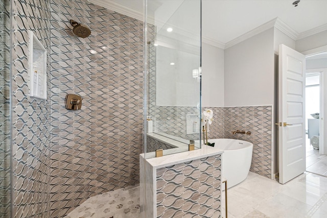 full bath featuring crown molding, tile walls, a freestanding bath, and walk in shower