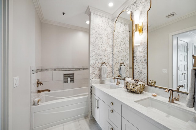 full bathroom featuring a bath, crown molding, visible vents, and a sink