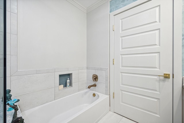 bathroom with ornamental molding, a garden tub, and tile patterned floors