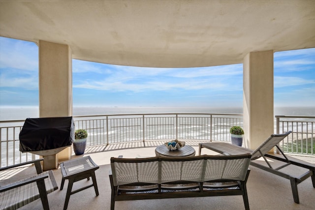 balcony featuring a water view