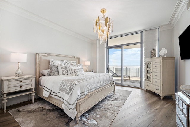 bedroom featuring access to outside, expansive windows, ornamental molding, and dark wood finished floors