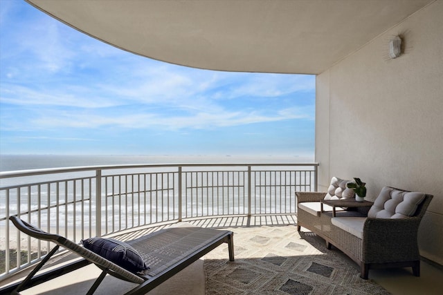 balcony with a view of the beach and a water view