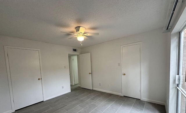 1516 Bay Area Blvd Unit S6, B9, E7, S11, K15, K3, Houston, TX 77058 - unfurnished bedroom with a ceiling fan, a textured ceiling, baseboards, and visible vents