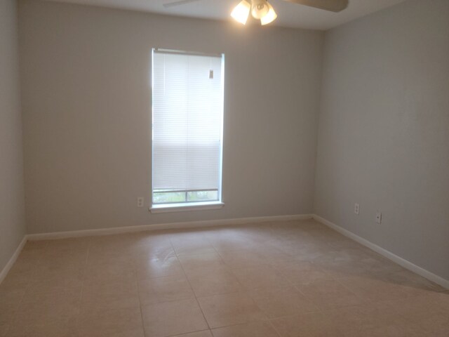 1516 Bay Area Blvd Unit S6, B9, E7, S11, K15, K3, Houston, TX 77058 - spare room with baseboards, ceiling fan, and light tile patterned floors