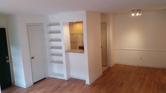 1516 Bay Area Blvd Unit S6, B9, E7, S11, K15, K3, Houston, TX 77058 - hallway featuring baseboards and light wood-type flooring