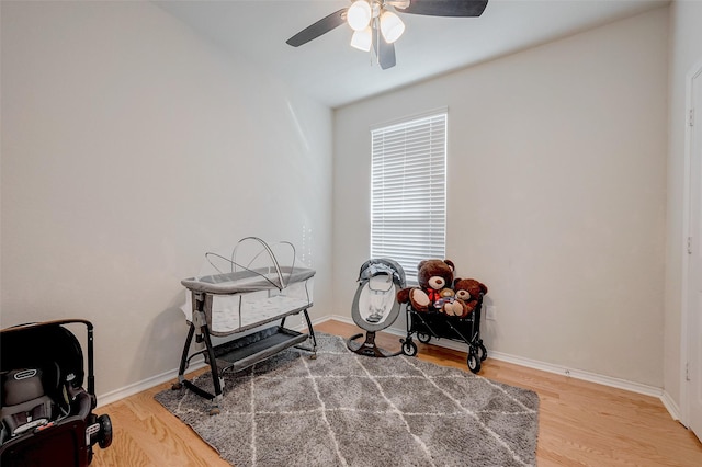 miscellaneous room featuring ceiling fan and hardwood / wood-style floors