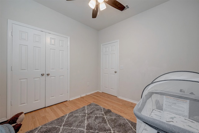 interior space with hardwood / wood-style flooring, a closet, and ceiling fan