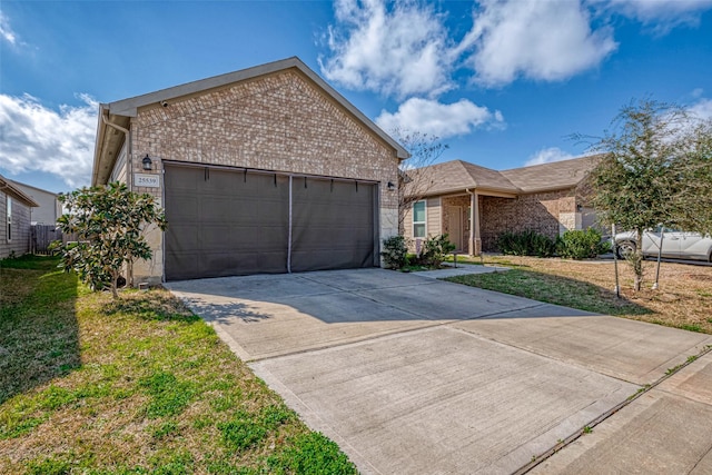 view of front of property with a garage and a front yard