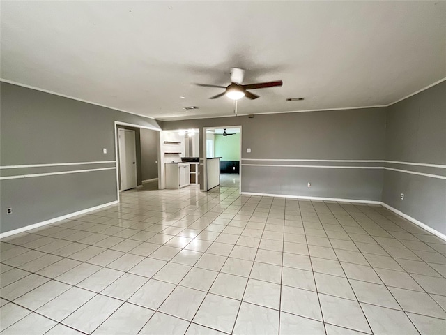 unfurnished room with light tile patterned floors and ceiling fan