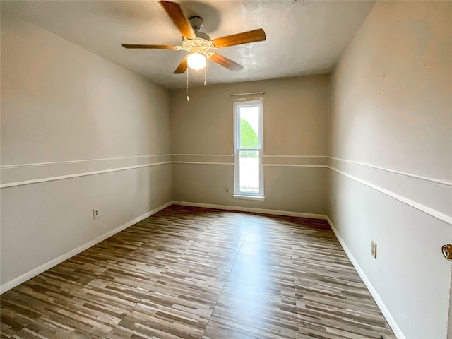 empty room featuring ceiling fan and light wood-type flooring