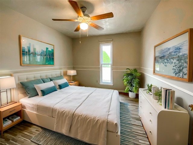 bedroom with hardwood / wood-style floors and ceiling fan