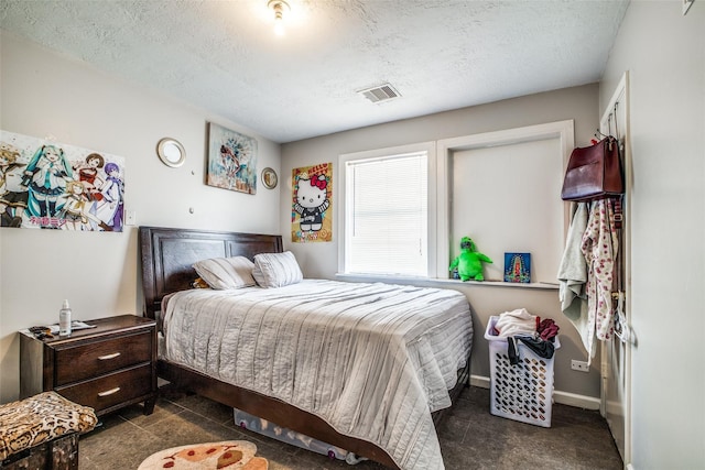 bedroom featuring a textured ceiling