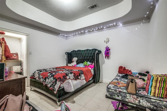 bedroom featuring a textured ceiling