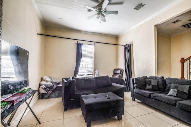 living room with ornamental molding, light tile patterned floors, and ceiling fan