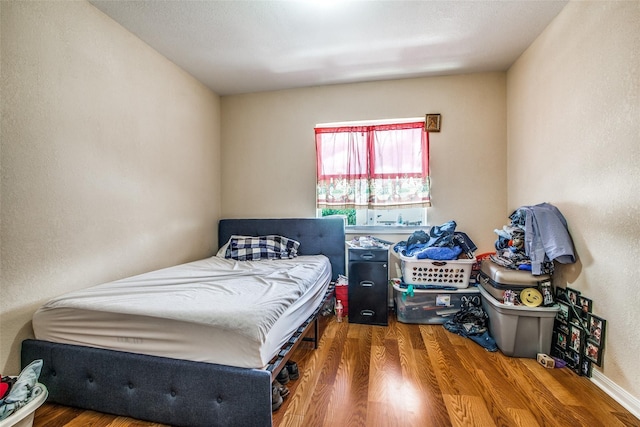 bedroom featuring hardwood / wood-style floors