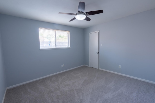 carpeted empty room with ceiling fan