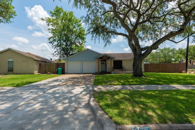 single story home with a garage and a front lawn