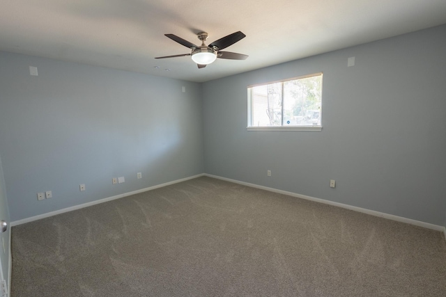 empty room featuring ceiling fan and carpet flooring