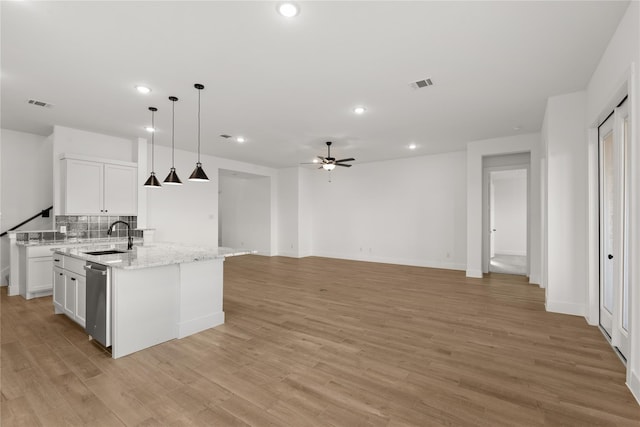 32626 Fly Fish Way, Fulshear, TX 77441 - kitchen featuring a sink, stainless steel dishwasher, a center island with sink, a ceiling fan, and white cabinets