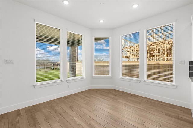 32626 Fly Fish Way, Fulshear, TX 77441 - spare room with baseboards, healthy amount of natural light, light wood-style floors, and recessed lighting