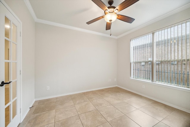 unfurnished room with light tile patterned floors, ceiling fan, baseboards, and ornamental molding