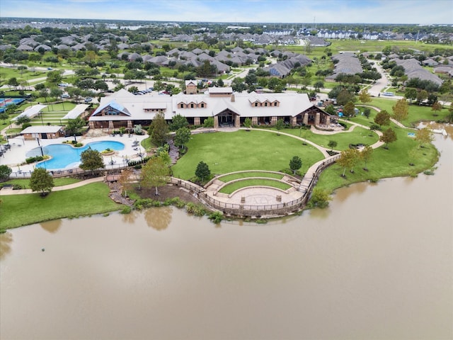 birds eye view of property featuring a residential view and a water view