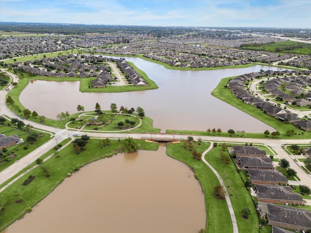 aerial view with a residential view and a water view