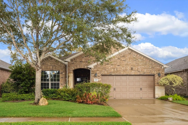 ranch-style home featuring brick siding, driveway, a front lawn, and a garage