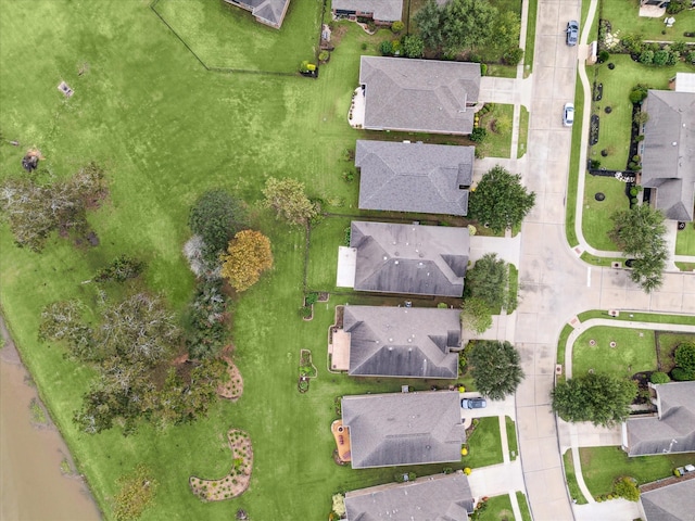 birds eye view of property with a residential view