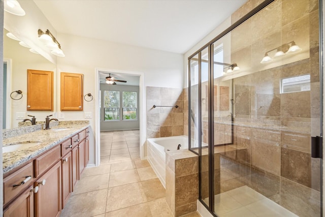 full bath featuring a garden tub, a stall shower, a sink, tile patterned flooring, and double vanity