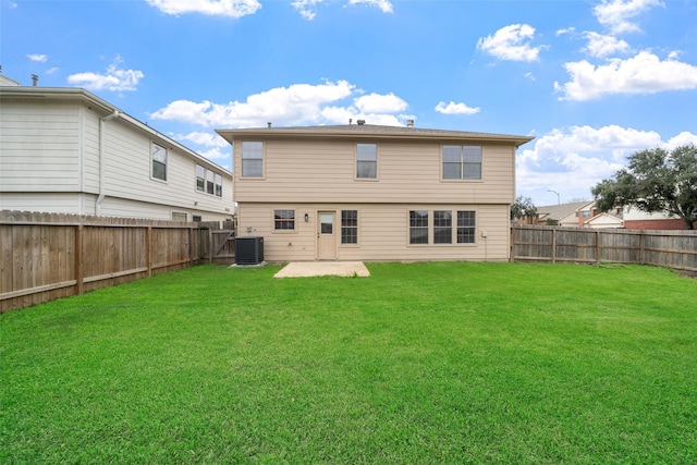 rear view of property featuring a lawn, a patio, and central air condition unit