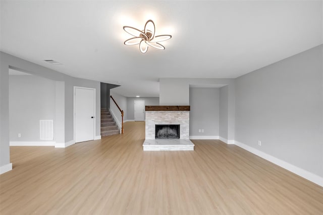 unfurnished living room with light hardwood / wood-style flooring