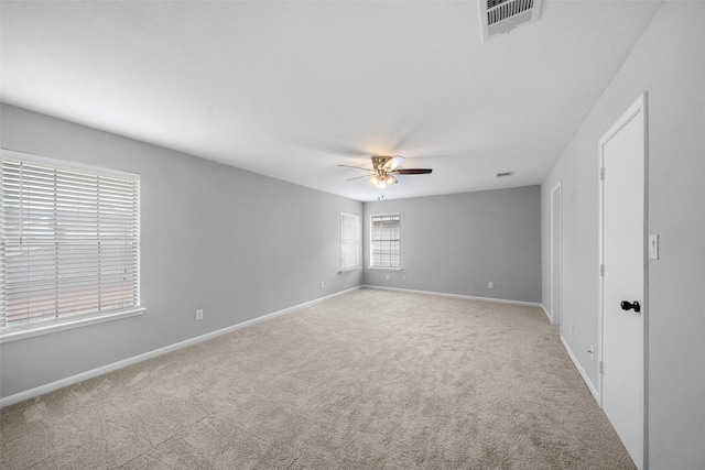 carpeted empty room with ceiling fan