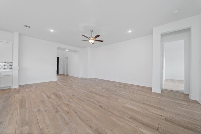 32646 Fly Fish Way, Fulshear, TX 77441 - unfurnished living room with a ceiling fan, light wood-type flooring, recessed lighting, and baseboards