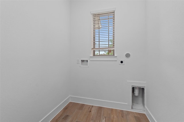 32646 Fly Fish Way, Fulshear, TX 77441 - laundry room with hookup for an electric dryer, baseboards, wood finished floors, and washer hookup