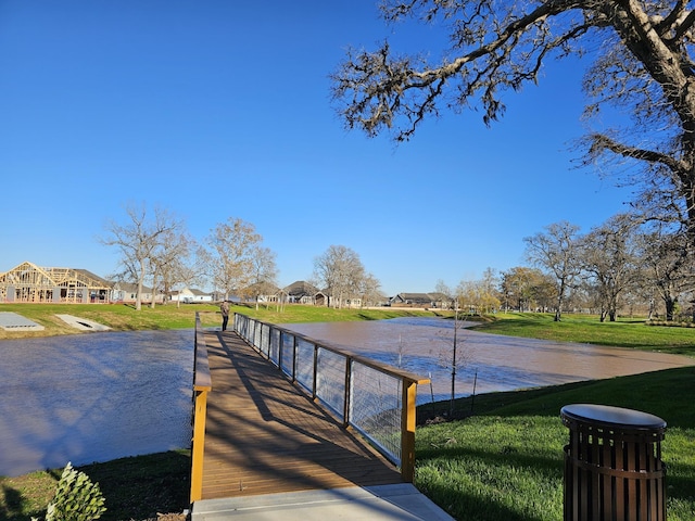 32646 Fly Fish Way, Fulshear, TX 77441 - dock with a yard, a residential view, and a water view